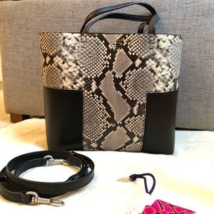 Authentic Tory Burch black leather tote bag with detachable shoulder strap.